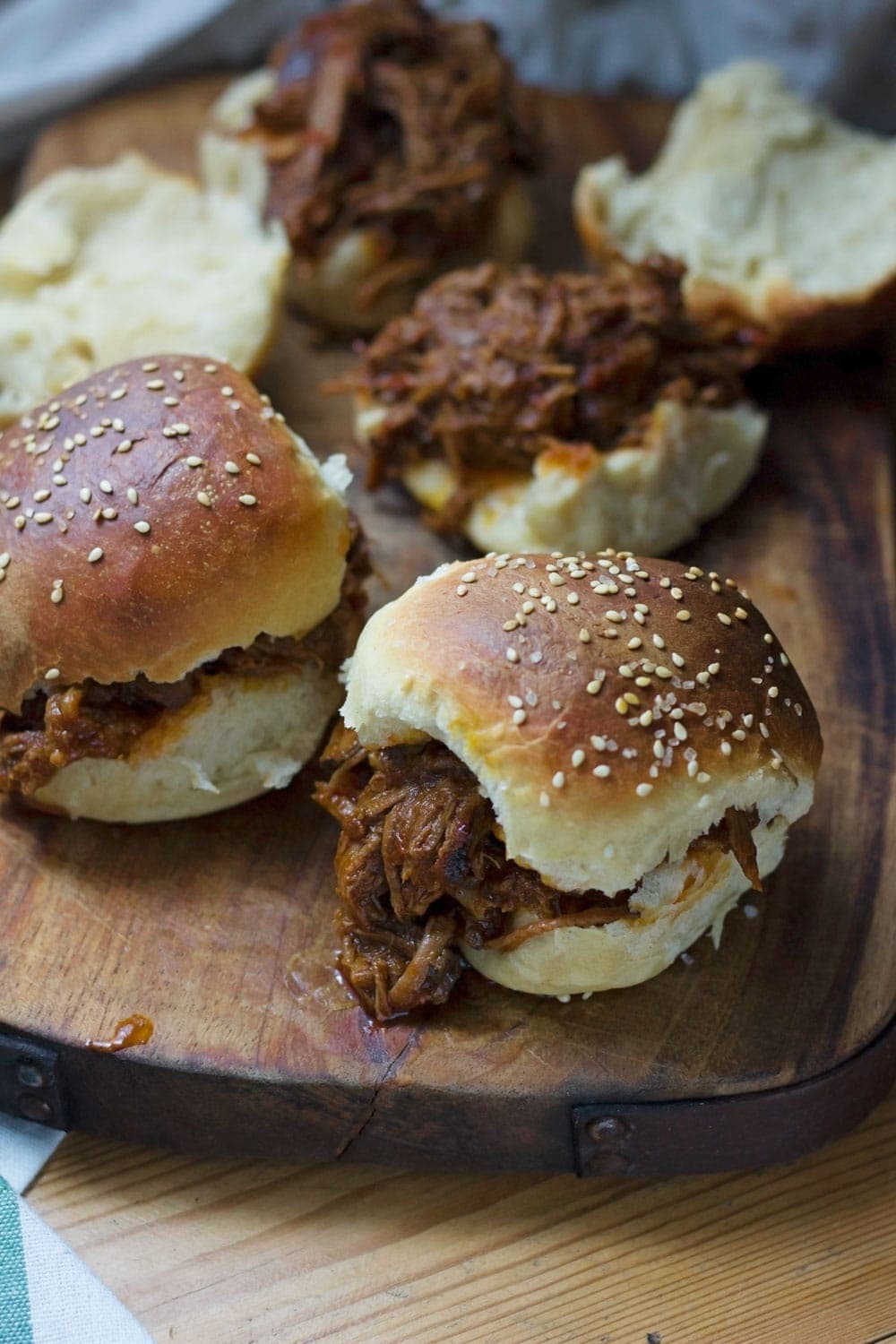 Beef brisket is slow cooked until meltingly tender for this spicy slow cooker pulled brisket. Serve in rolls or wraps for a delicious dinner!