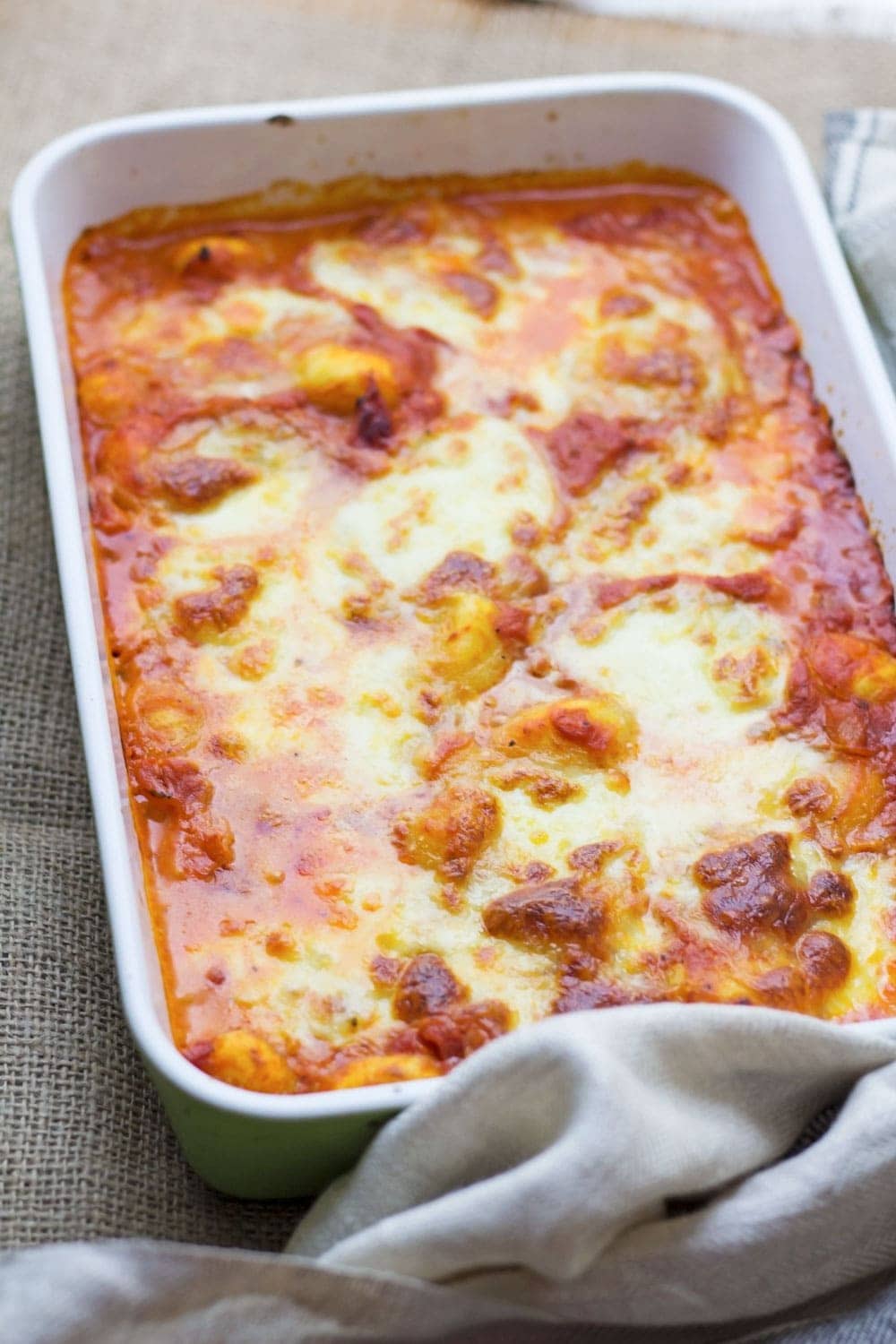 This cheese and tomato baked gnocchi is the perfect comfort dinner! Serve up a bowlful when you need a pick-me-up and you'll feel better in no time.