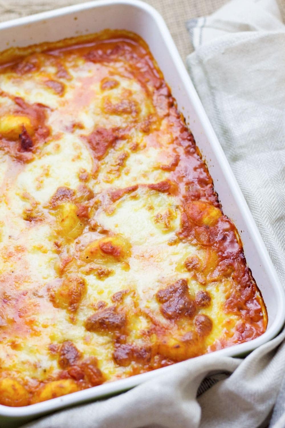 This cheese and tomato baked gnocchi is the perfect comfort dinner! Serve up a bowlful when you need a pick-me-up and you'll feel better in no time.