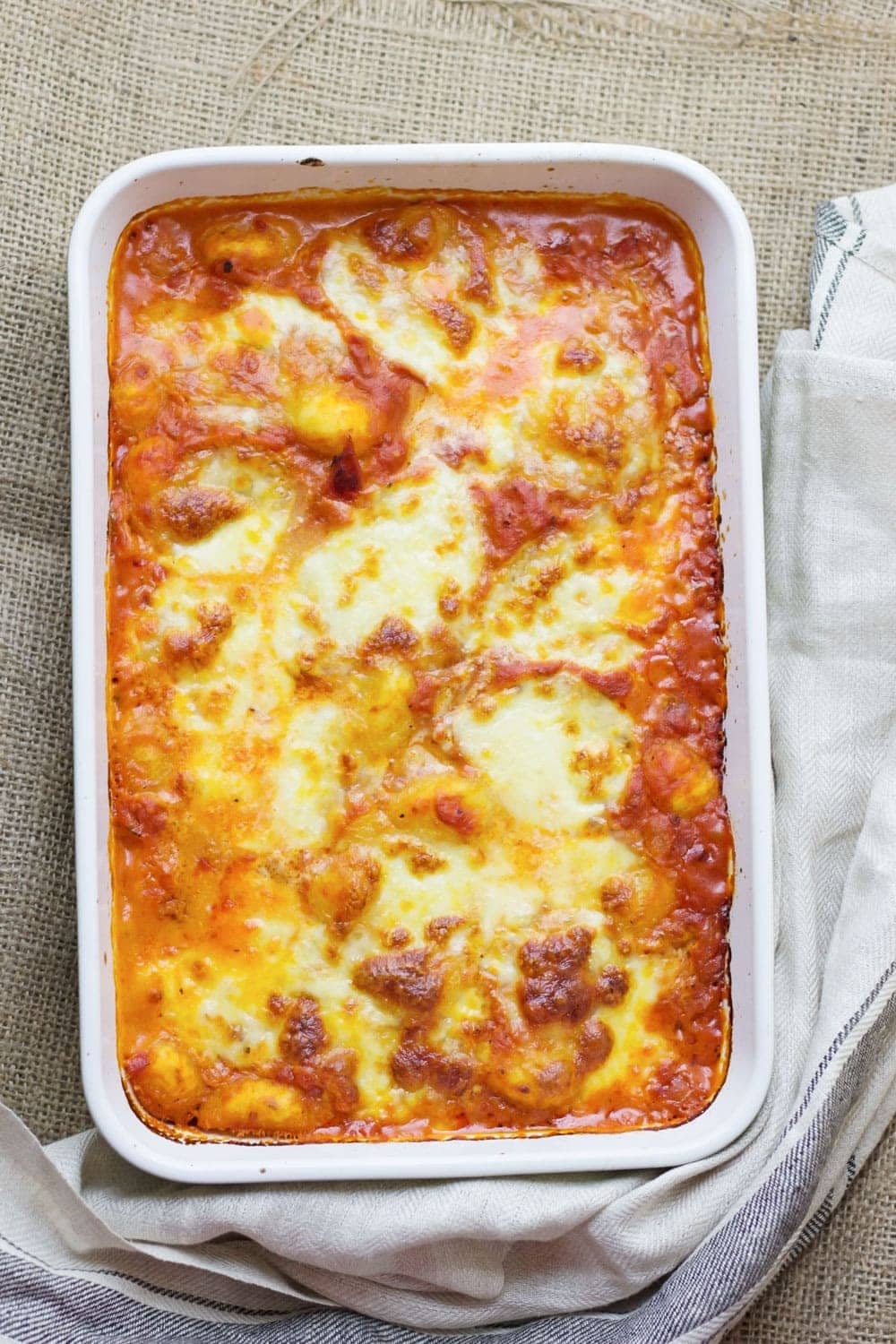 This cheese and tomato baked gnocchi is the perfect comfort dinner! Serve up a bowlful when you need a pick-me-up and you'll feel better in no time.