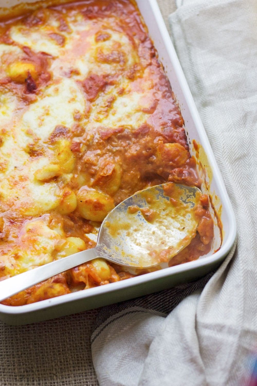 This cheese and tomato baked gnocchi is the perfect comfort dinner! Serve up a bowlful when you need a pick-me-up and you'll feel better in no time.