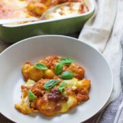 This cheese and tomato baked gnocchi is the perfect comfort dinner! Serve up a bowlful when you need a pick-me-up and you'll feel better in no time.