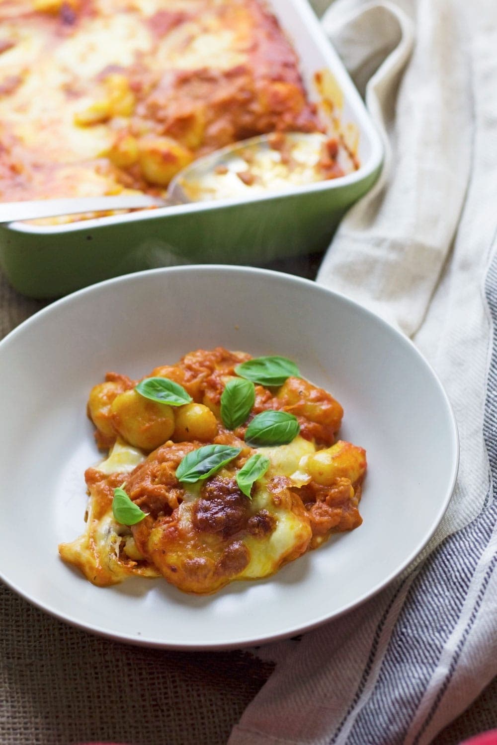 This cheese and tomato baked gnocchi is the perfect comfort dinner! Serve up a bowlful when you need a pick-me-up and you'll feel better in no time.