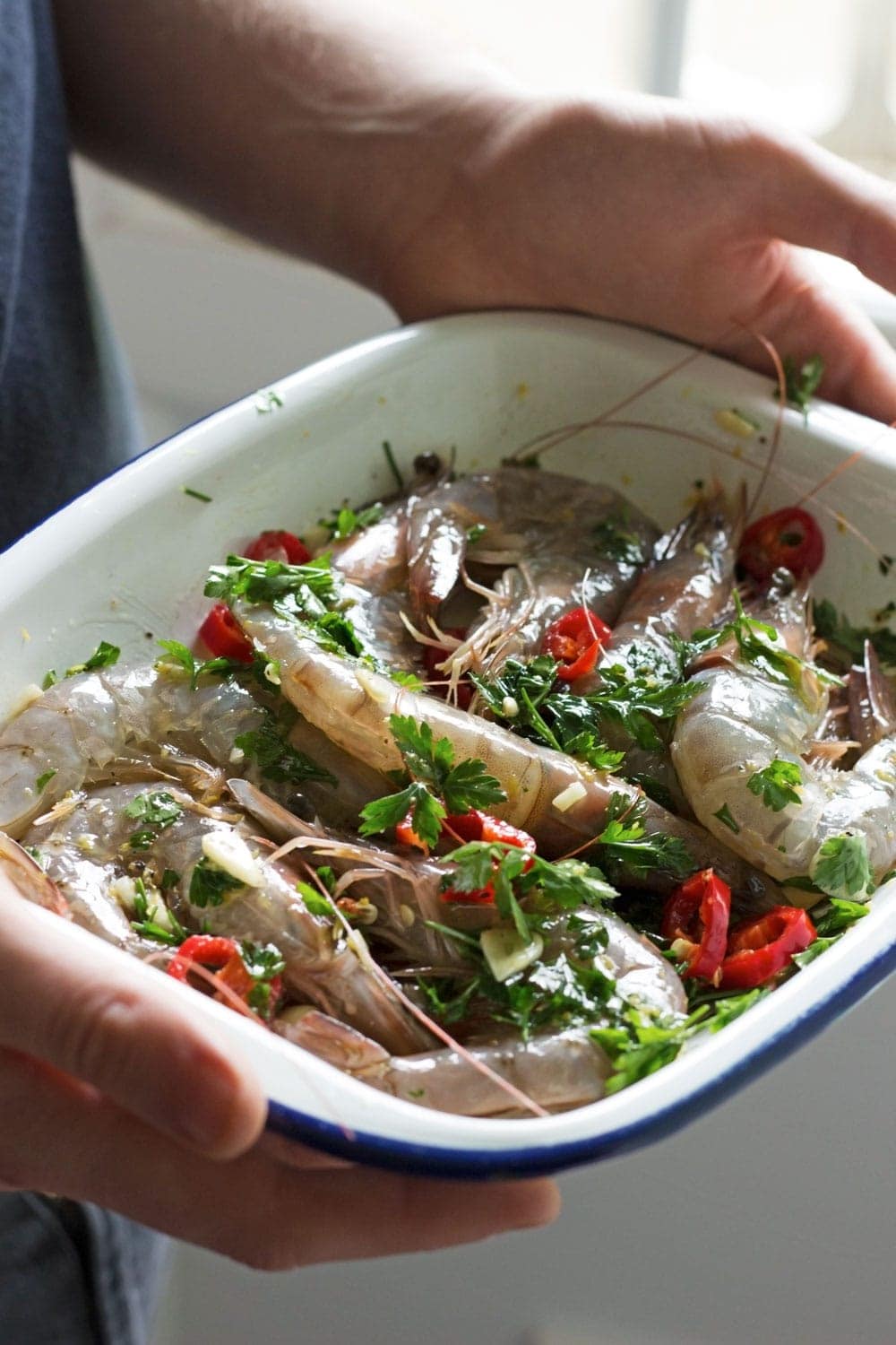 This chilli & garlic prawns recipe is the perfect thing to serve at a summer dinner party! It's quick, simple and is guaranteed to impress.