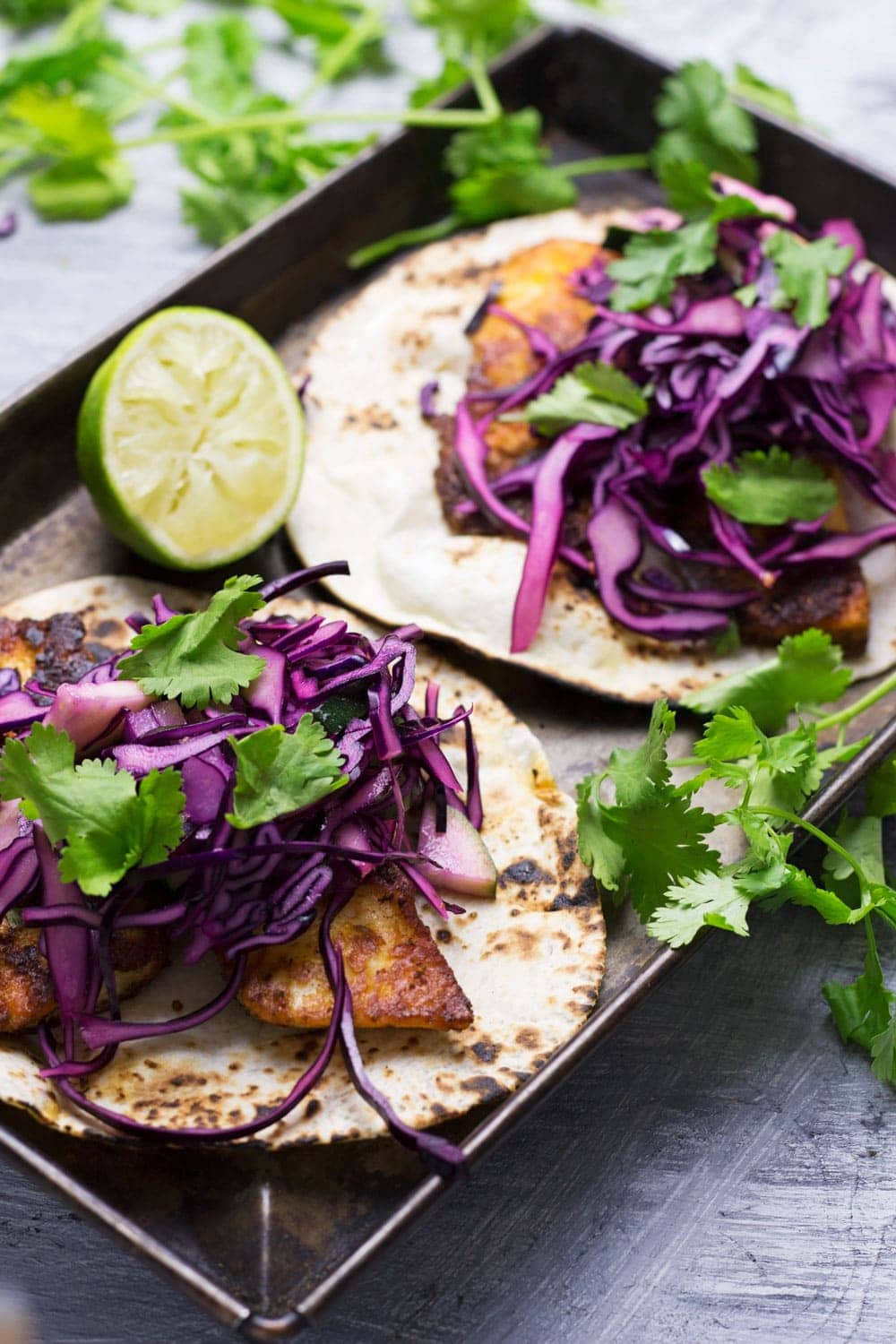 These halloumi tacos are beautifully spiced and topped with a fresh and healthy cabbage slaw. An ideal vegetarian Mexican dinner!