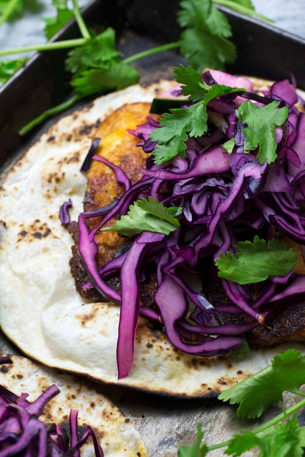 These halloumi tacos are beautifully spiced and topped with a fresh and healthy cabbage slaw. An ideal vegetarian Mexican dinner!