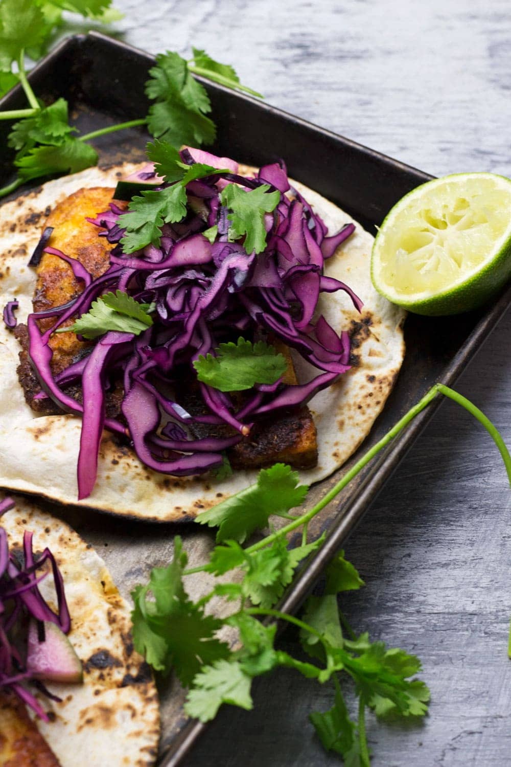 These halloumi tacos are beautifully spiced and topped with a fresh and healthy cabbage slaw. An ideal vegetarian Mexican dinner!
