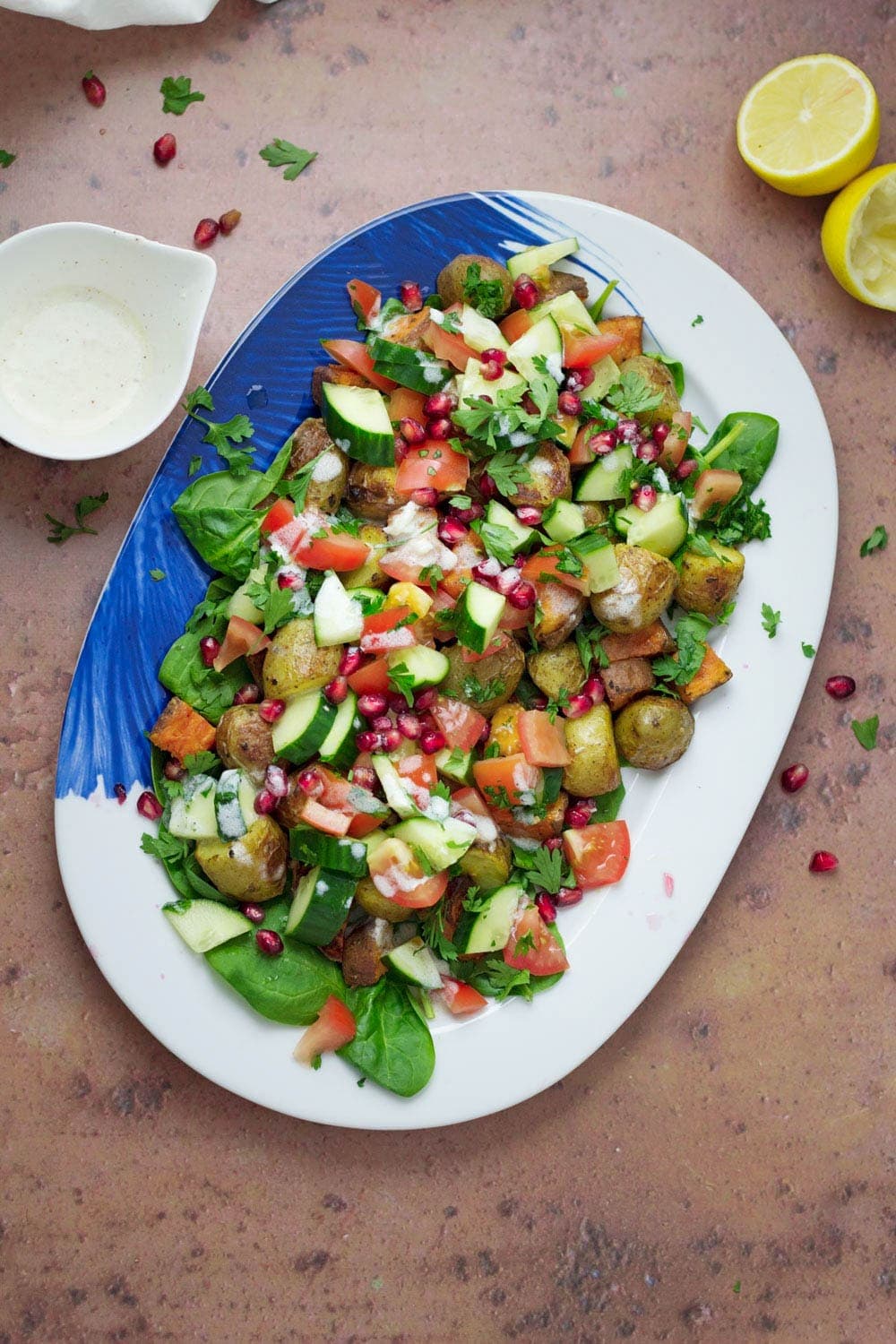 Overhead shot of potato salad with lemon and dressing 