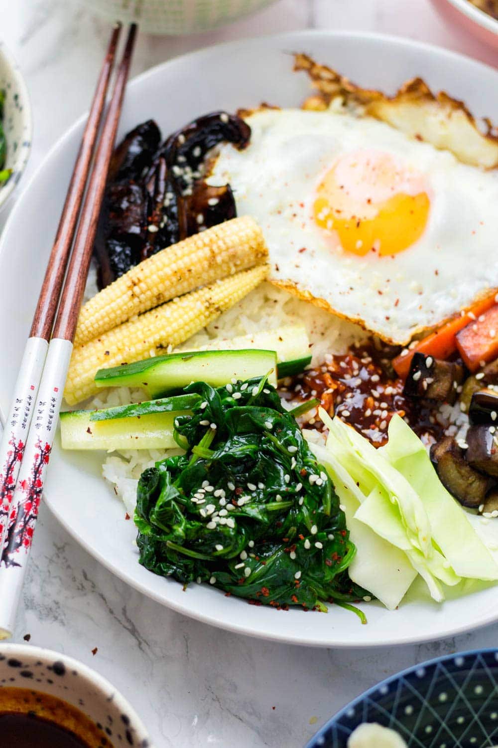 Close up of vegetarian bibimbap in a white bowl