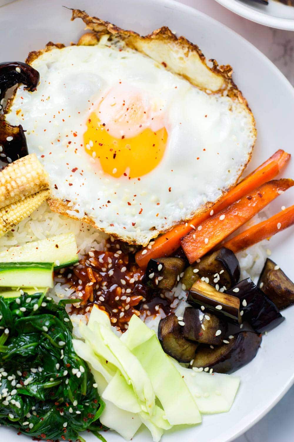 Close up of egg on vegetarian bibimbap