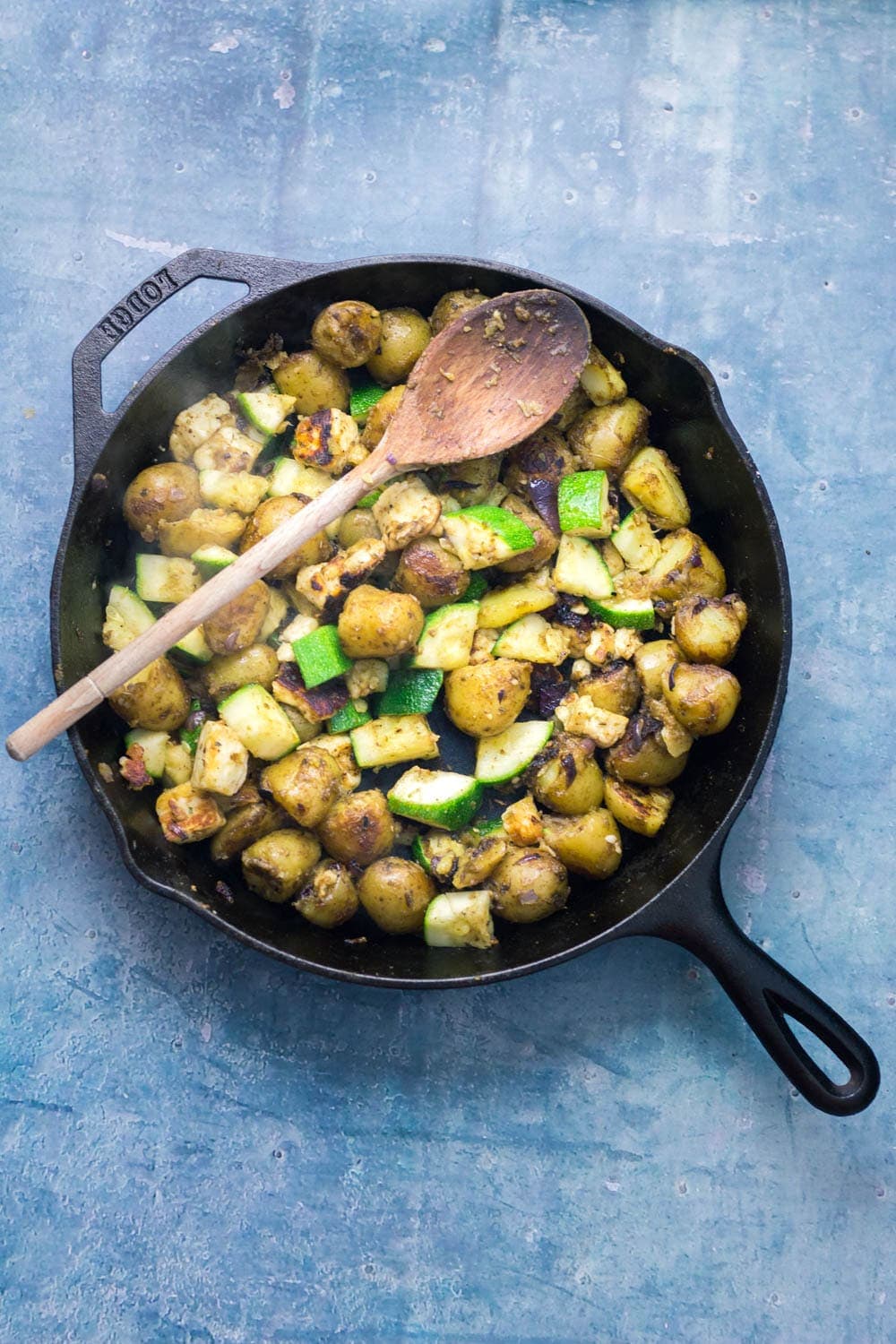 I love this potato, courgette & halloumi hash for breakfast, lunch or dinner! Topped with an easy tomato sauce & a poached egg it's a guaranteed winner.