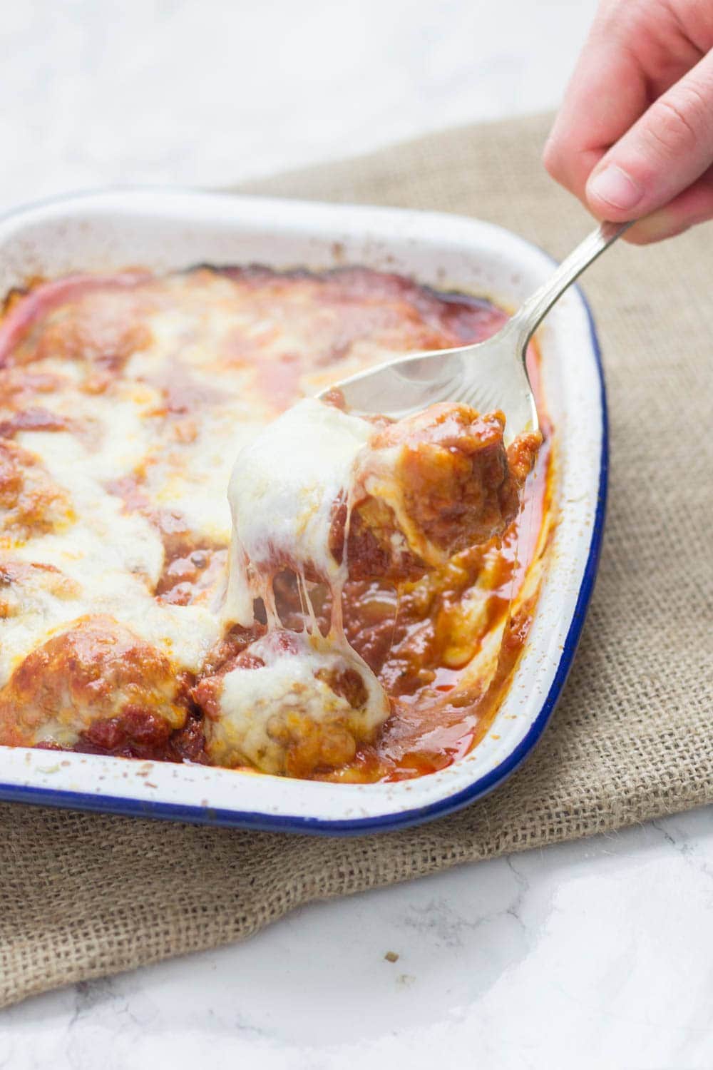 These cheesy baked meatball sandwiches are the perfect thing to feed a crowd! Serve for a party or just as a weeknight dinner the whole family will love.