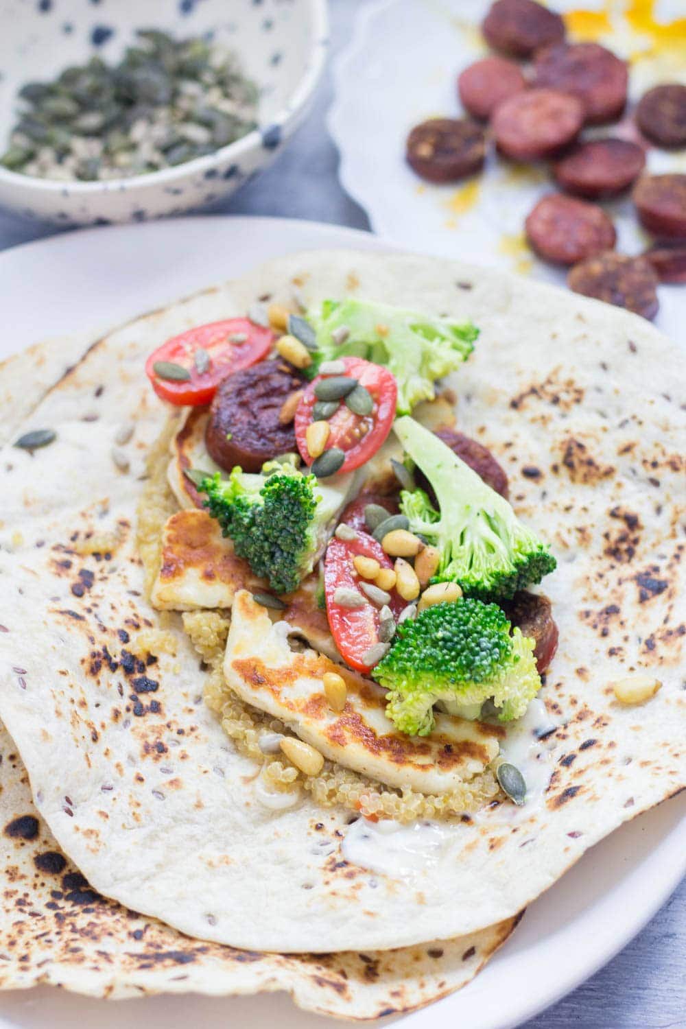 Halloumi & chorizo wraps are such a tasty lunch or dinner. The halloumi & chorizo are wrapped with a fresh broccoli slaw and a sprinkling of nuts and seeds.
