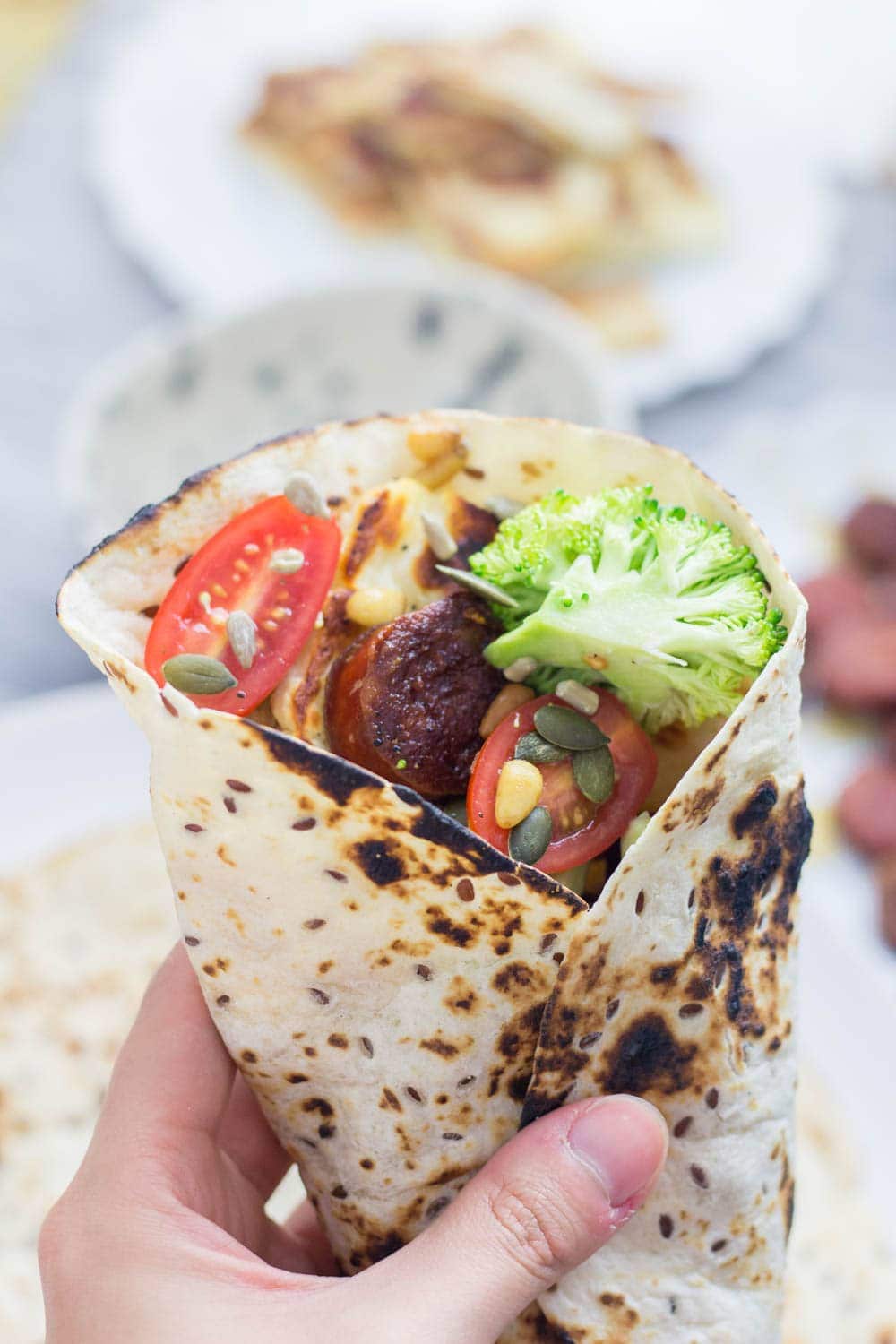 Halloumi & chorizo wraps are such a tasty lunch or dinner. The halloumi & chorizo are wrapped with a fresh broccoli slaw and a sprinkling of nuts and seeds.