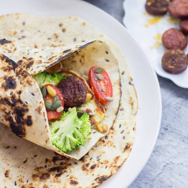 Halloumi & chorizo wraps are such a tasty lunch or dinner. The halloumi & chorizo are wrapped with a fresh broccoli slaw and a sprinkling of nuts and seeds.