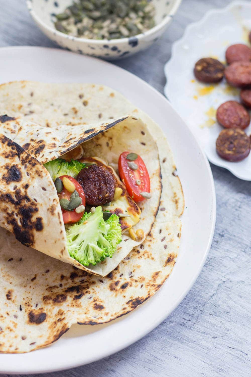 Halloumi & chorizo wraps are such a tasty lunch or dinner. The halloumi & chorizo are wrapped with a fresh broccoli slaw and a sprinkling of nuts and seeds.