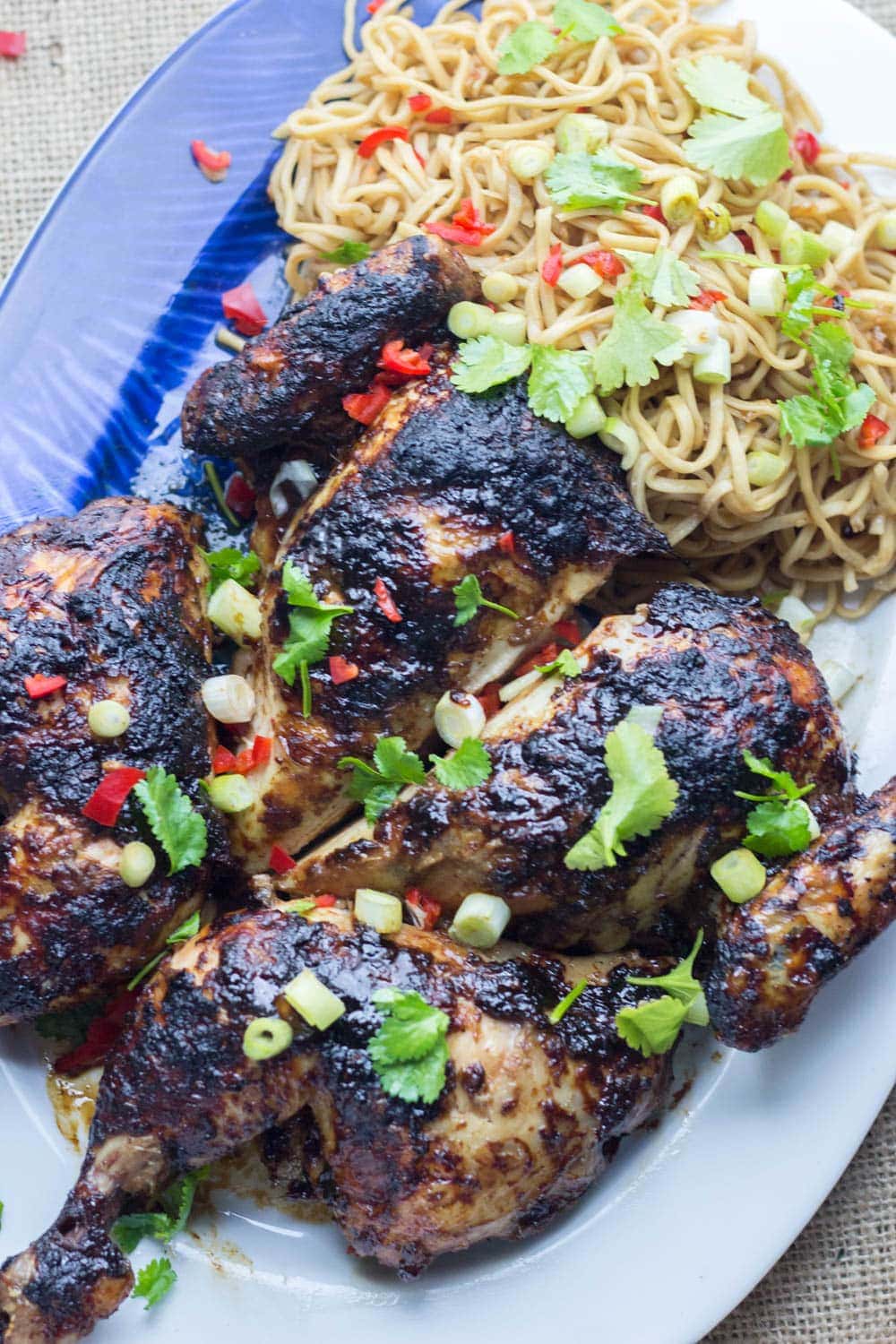 Asian Roasted Spatchcock Chicken with Noodle Salad. This Asian roasted spatchcock chicken is a great way to mix up a roast dinner. I love mine served with a refreshing noodle salad. #roastchicken #recipe #asianfood #spatchcock