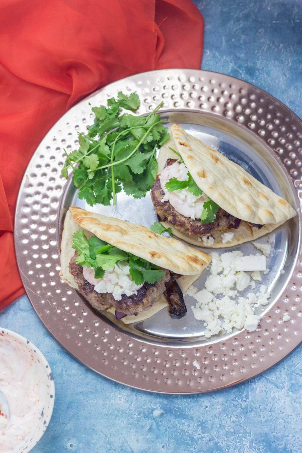 If you need a quick weeknight dinner that's guaranteed to impress then this Moroccan lamb burger flatbread recipe is what you need! #lamb #burger #dinner #recipe