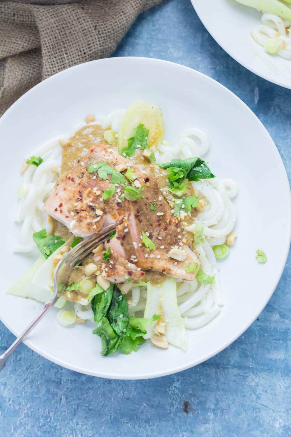 Peanut salmon noodles in a white bowl