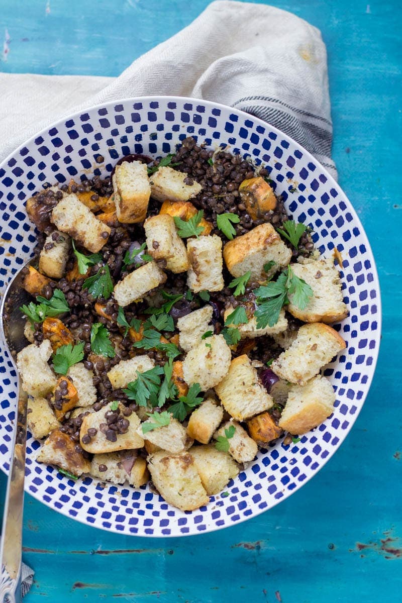 Baked Halloumi with Winter Panzanella. Halloumi is the perfect addition to a meat free meal! Bake it in the oven with loads of herbs and serve along side this filling winter panzanella style salad for your next vegetarian dinner.  #panzanella #salad #halloumi #recipe