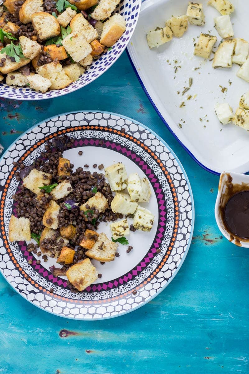 Baked Halloumi with Winter Panzanella. Halloumi is the perfect addition to a meat free meal! Bake it in the oven with loads of herbs and serve along side this filling winter panzanella style salad for your next vegetarian dinner.  #panzanella #salad #halloumi #recipe