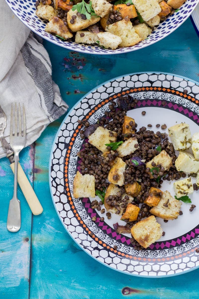 Baked Halloumi with Winter Panzanella. Halloumi is the perfect addition to a meat free meal! Bake it in the oven with loads of herbs and serve along side this filling winter panzanella style salad for your next vegetarian dinner.  #panzanella #salad #halloumi #recipe