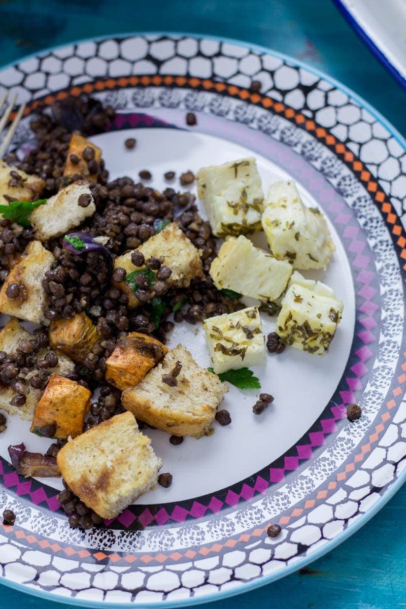 Baked Halloumi with Winter Panzanella. Halloumi is the perfect addition to a meat free meal! Bake it in the oven with loads of herbs and serve along side this filling winter panzanella style salad for your next vegetarian dinner.  #panzanella #salad #halloumi #recipe