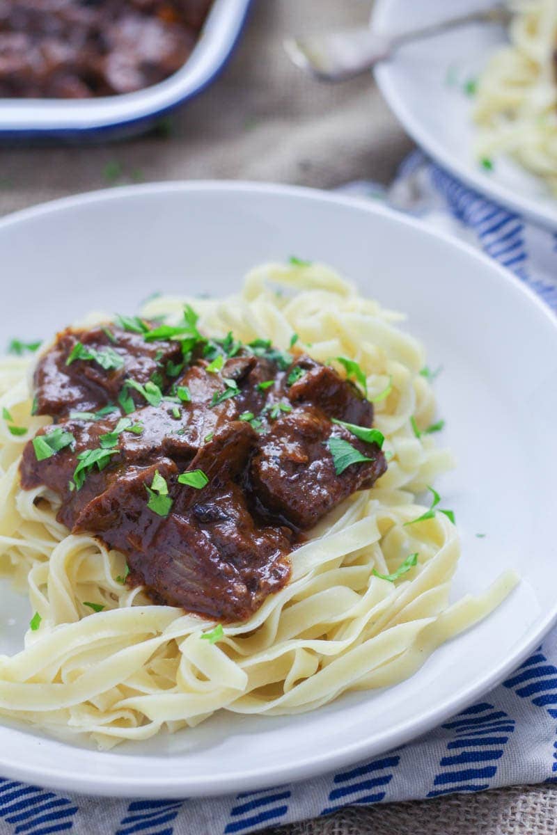 Easy Beef Stroganoff with Mushrooms. Make this easy beef stroganoff for a warming winter dinner. There's really nothing better than tender beef cooked with red wine and vegetables. #beefstroganoff #recipe #beef