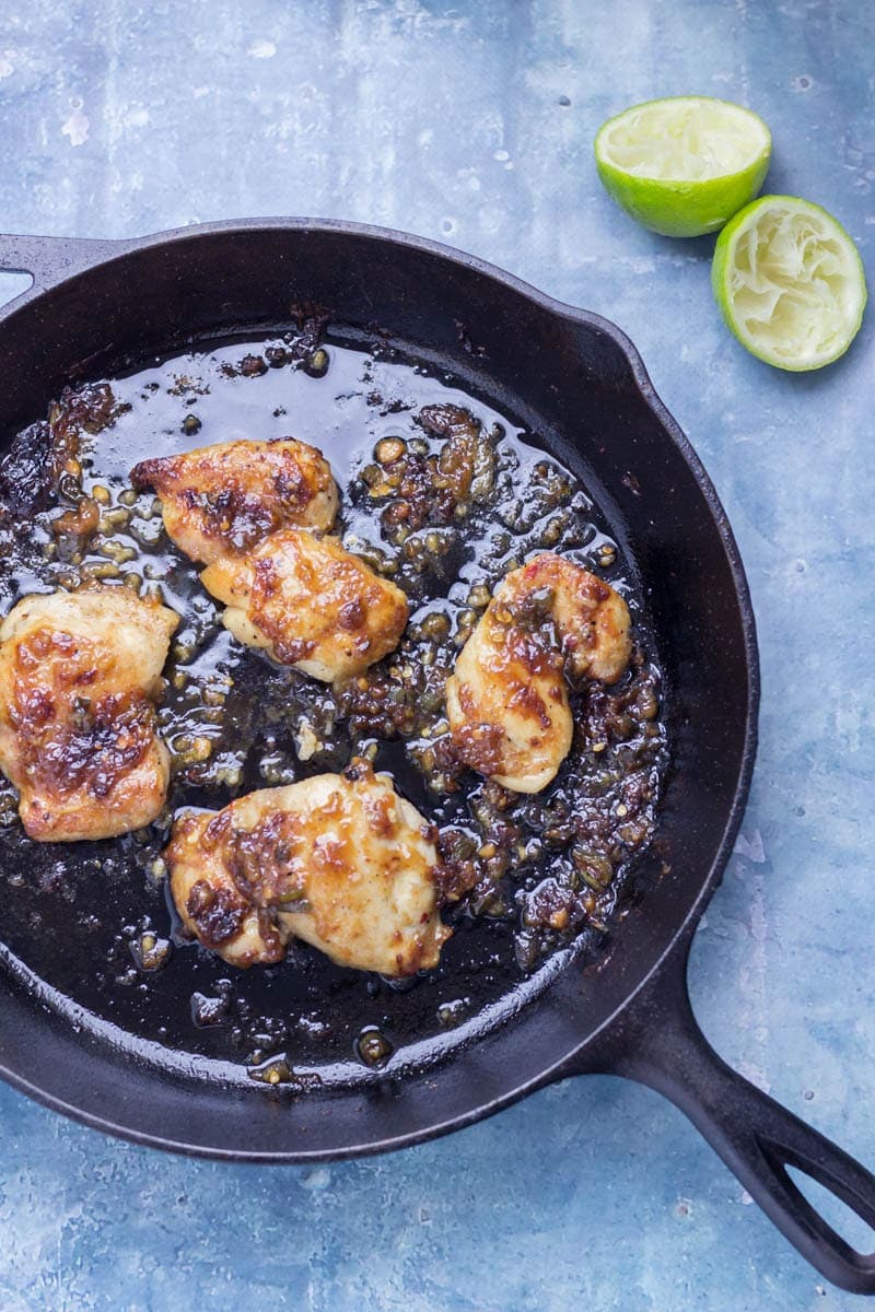 Thai Coconut Chicken Skillet with Asian Slaw. This Thai coconut chicken skillet is super sticky and full of flavour. Served with a refreshing Asian slaw it's the perfect weeknight dinner! #thaifood #recipe #skillet #chicken