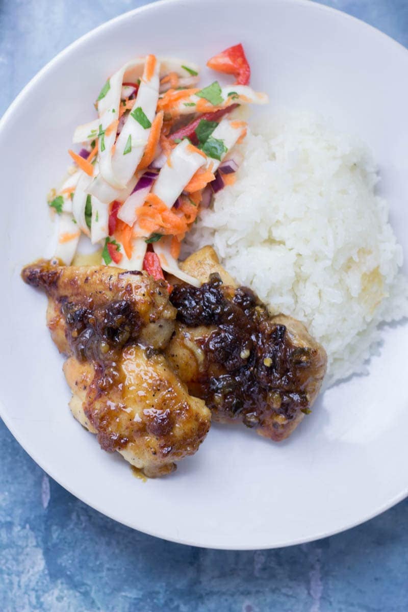 Thai Coconut Chicken Skillet with Asian Slaw. This Thai coconut chicken skillet is super sticky and full of flavour. Served with a refreshing Asian slaw it's the perfect weeknight dinner! #thaifood #recipe #skillet #chicken