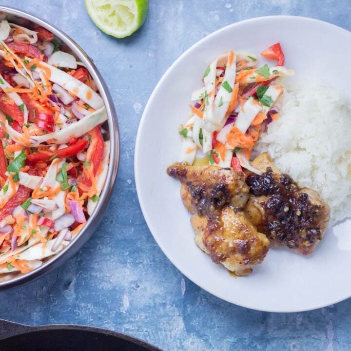 Thai Coconut Chicken Skillet with Asian Slaw. This Thai coconut chicken skillet is super sticky and full of flavour. Served with a refreshing Asian slaw it's the perfect weeknight dinner! #thaifood #recipe #skillet #chicken