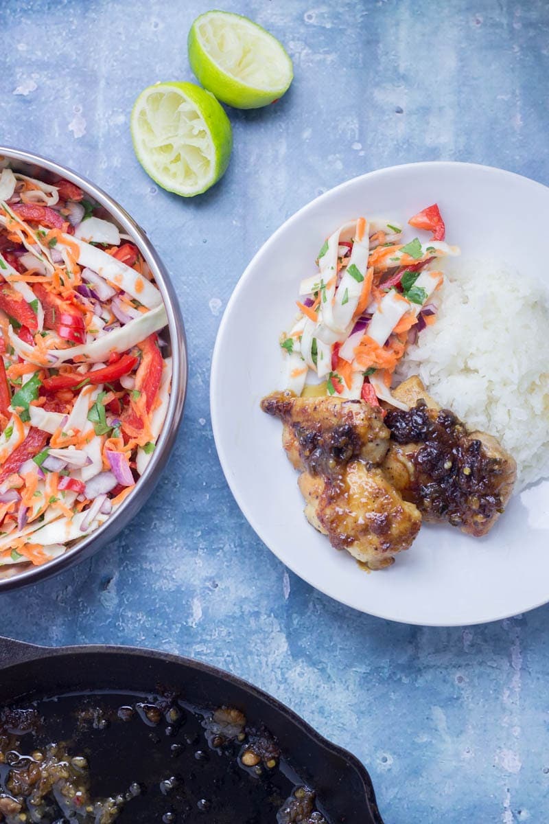 Thai Coconut Chicken Skillet with Asian Slaw. This Thai coconut chicken skillet is super sticky and full of flavour. Served with a refreshing Asian slaw it's the perfect weeknight dinner! #thaifood #recipe #skillet #chicken