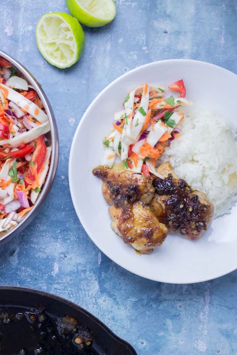 Thai Coconut Chicken Skillet with Asian Slaw. This Thai coconut chicken skillet is super sticky and full of flavour. Served with a refreshing Asian slaw it's the perfect weeknight dinner! #thaifood #recipe #skillet #chicken