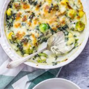 Cheesy Baked Gnocchi with Kale & Brussels Sprouts. There is nothing more comforting than this cheesy baked gnocchi. It's bulked out with kale and Brussels sprouts for a satisfying dinner which is still pretty healthy! #gnocchi #bakedgnocchi #kale #sprouts #comfortfood #recipe