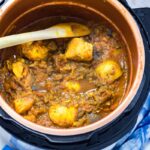 Pressure Cooker Curry with Potato & Aubergine. You won't believe how quick and easy this pressure cooker curry is! It's perfect for an instant pot or any electric pressure cooker. Serve with rice for a healthy vegetarian dinner. #curry#pressurecooker #instantpot #vegetarian #curry