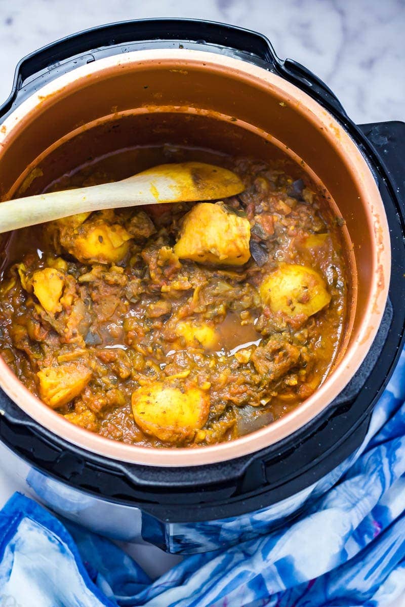 Overhead shot of pressure cooker curry with potato and aubergine