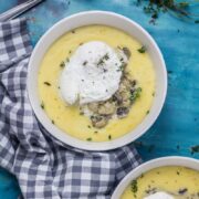 Creamy Mushrooms with Mascarpone Polenta. These creamy mushrooms over indulgent marscarpone polenta are just as good for a winter weeknight dinner as they are for a romantic Valentine's meal. Serve with a poached egg on top for an amazing vegetarian feast. #polenta #recipe #vegetarian #mushroom #creamymushrooms