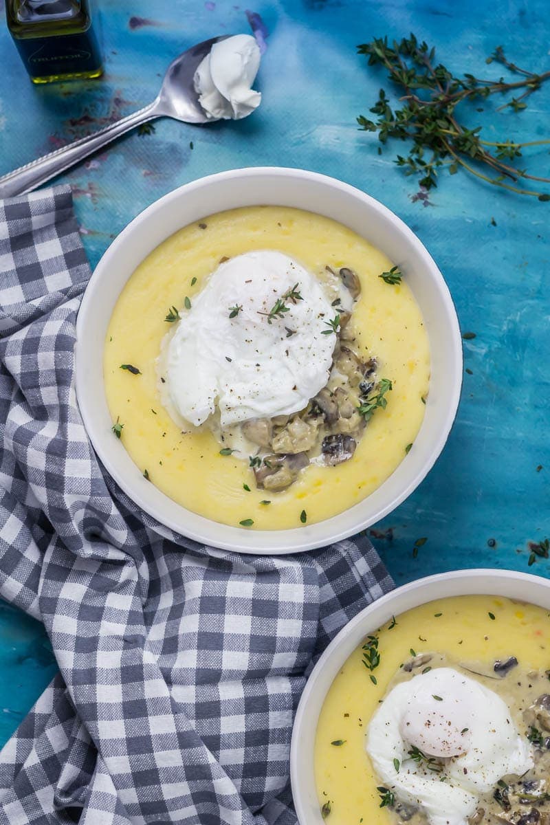 Creamy Mushrooms with Mascarpone Polenta. These creamy mushrooms over indulgent mascarpone polenta are just as good for a winter weeknight dinner as they are for a romantic Valentine's meal. Serve with a poached egg on top for an amazing vegetarian feast. #polenta #recipe #vegetarian #mushroom #creamymushrooms