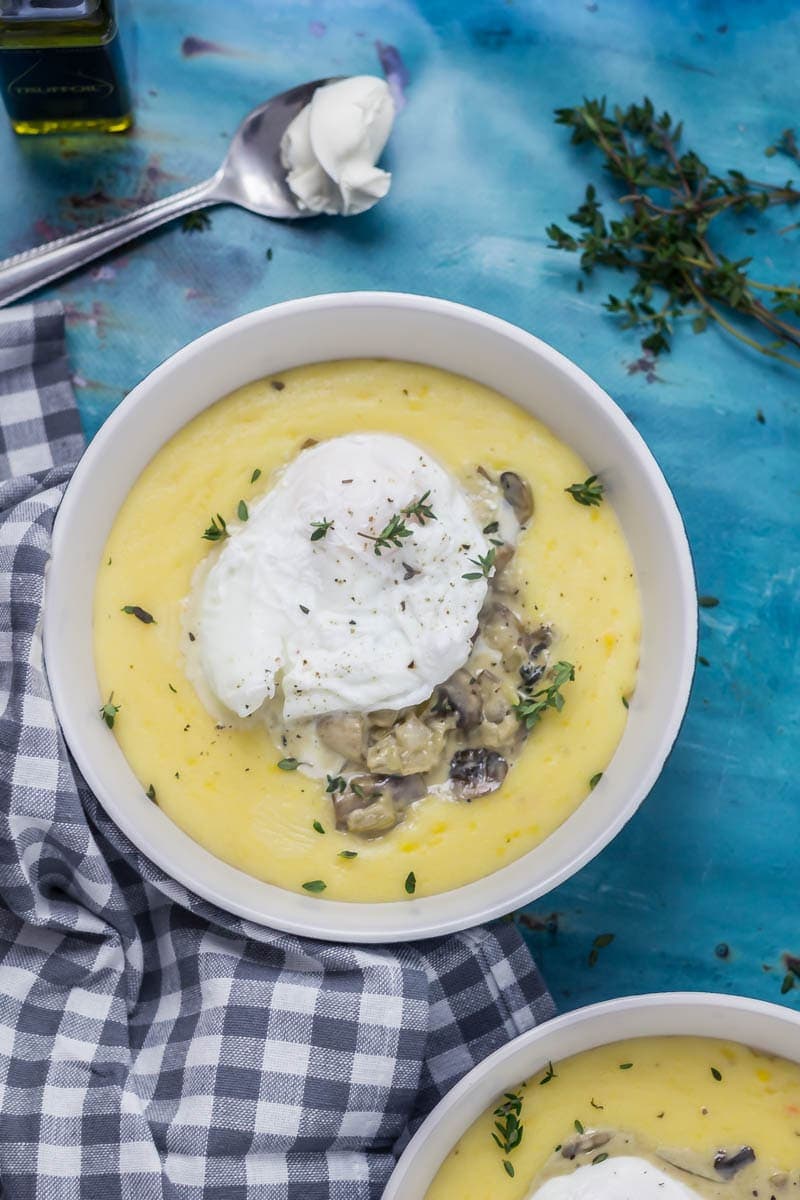 Creamy Mushrooms with Mascarpone Polenta. These creamy mushrooms over indulgent mascarpone polenta are just as good for a winter weeknight dinner as they are for a romantic Valentine's meal. Serve with a poached egg on top for an amazing vegetarian feast. #polenta #recipe #vegetarian #mushroom #creamymushrooms