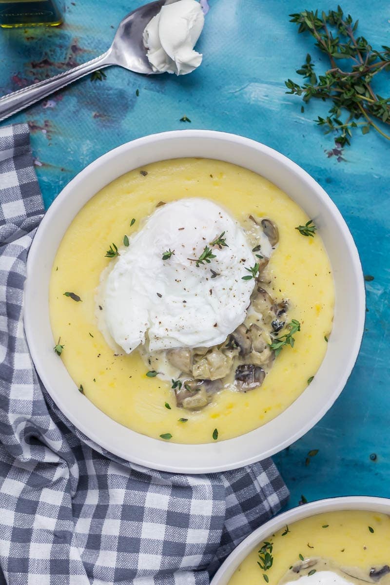 Creamy Mushrooms with Mascarpone Polenta. These creamy mushrooms over indulgent mascarpone polenta are just as good for a winter weeknight dinner as they are for a romantic Valentine's meal. Serve with a poached egg on top for an amazing vegetarian feast. #polenta #recipe #vegetarian #mushroom #creamymushrooms