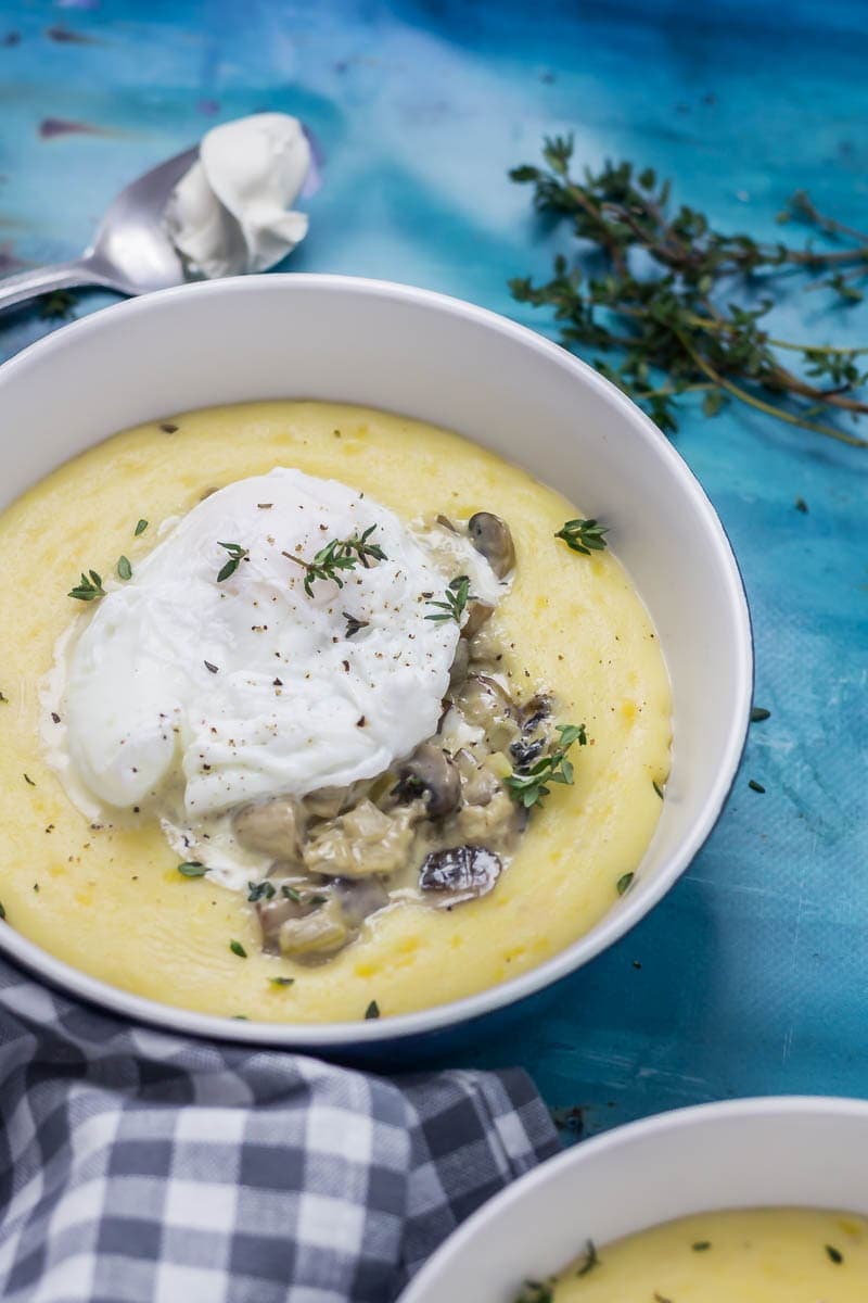 Creamy Mushrooms with Mascarpone Polenta. These creamy mushrooms over indulgent mascarpone polenta are just as good for a winter weeknight dinner as they are for a romantic Valentine's meal. Serve with a poached egg on top for an amazing vegetarian feast. #polenta #recipe #vegetarian #mushroom #creamymushrooms