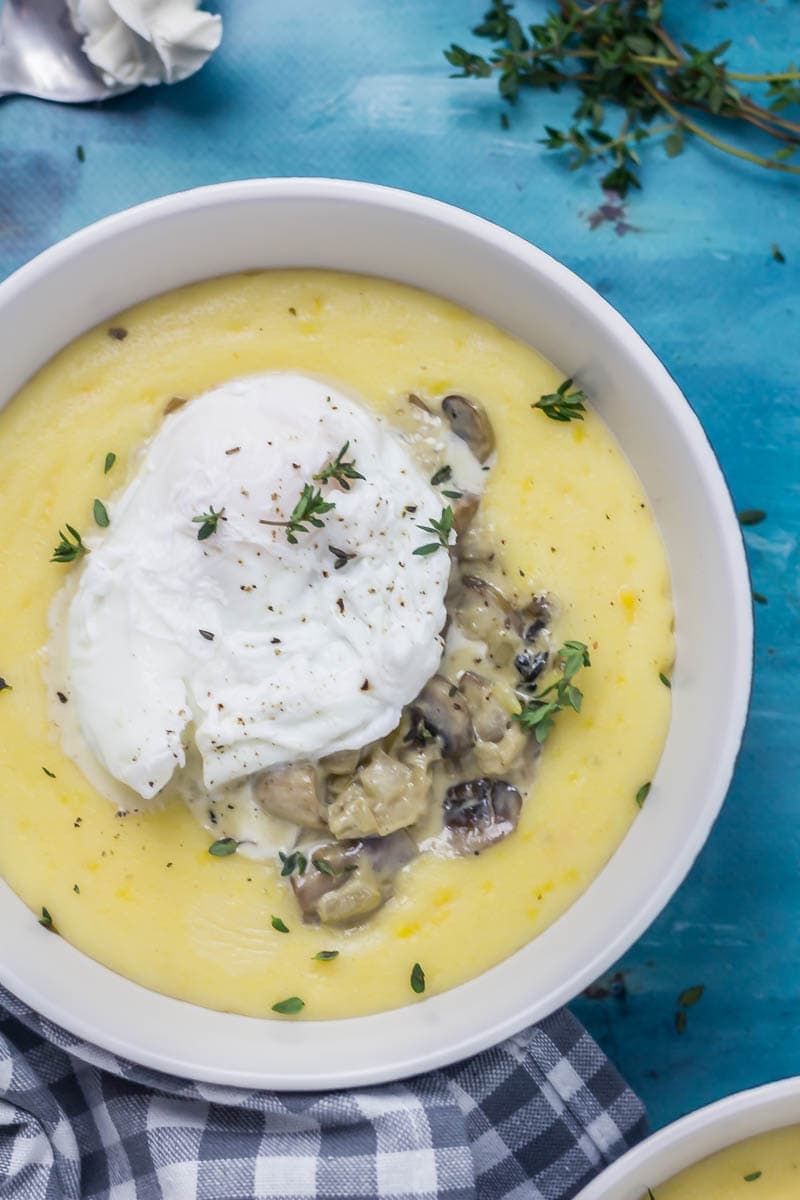 Creamy Mushrooms with Mascarpone Polenta. These creamy mushrooms over indulgent mascarpone polenta are just as good for a winter weeknight dinner as they are for a romantic Valentine's meal. Serve with a poached egg on top for an amazing vegetarian feast. #polenta #recipe #vegetarian #mushroom #creamymushrooms