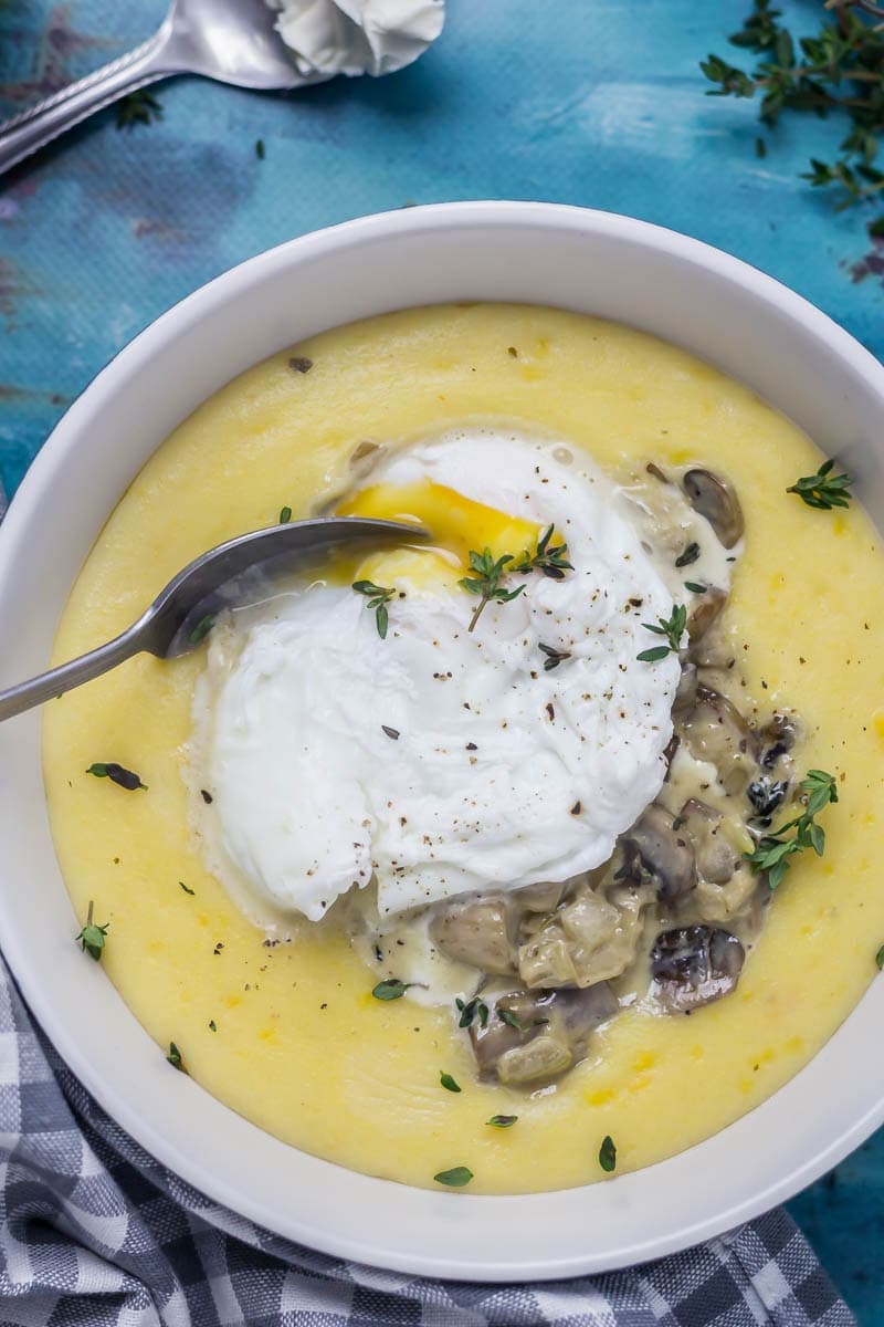 Creamy Mushrooms with Mascarpone Polenta. These creamy mushrooms over indulgent mascarpone polenta are just as good for a winter weeknight dinner as they are for a romantic Valentine's meal. Serve with a poached egg on top for an amazing vegetarian feast. #polenta #recipe #vegetarian #mushroom #creamymushrooms