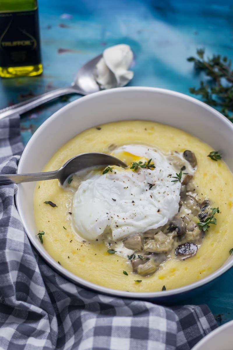 Creamy Mushrooms with Mascarpone Polenta. These creamy mushrooms over indulgent marscarpone polenta are just as good for a winter weeknight dinner as they are for a romantic Valentine's meal. Serve with a poached egg on top for an amazing vegetarian feast. #polenta #recipe #vegetarian #mushroom #creamymushrooms