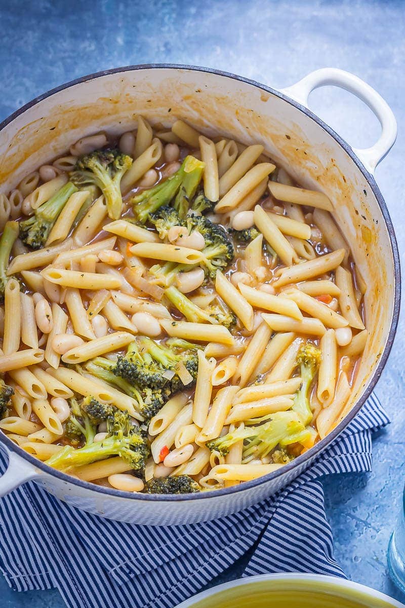 Pot of Broccoli and White Bean One Pot Pasta on a blue background