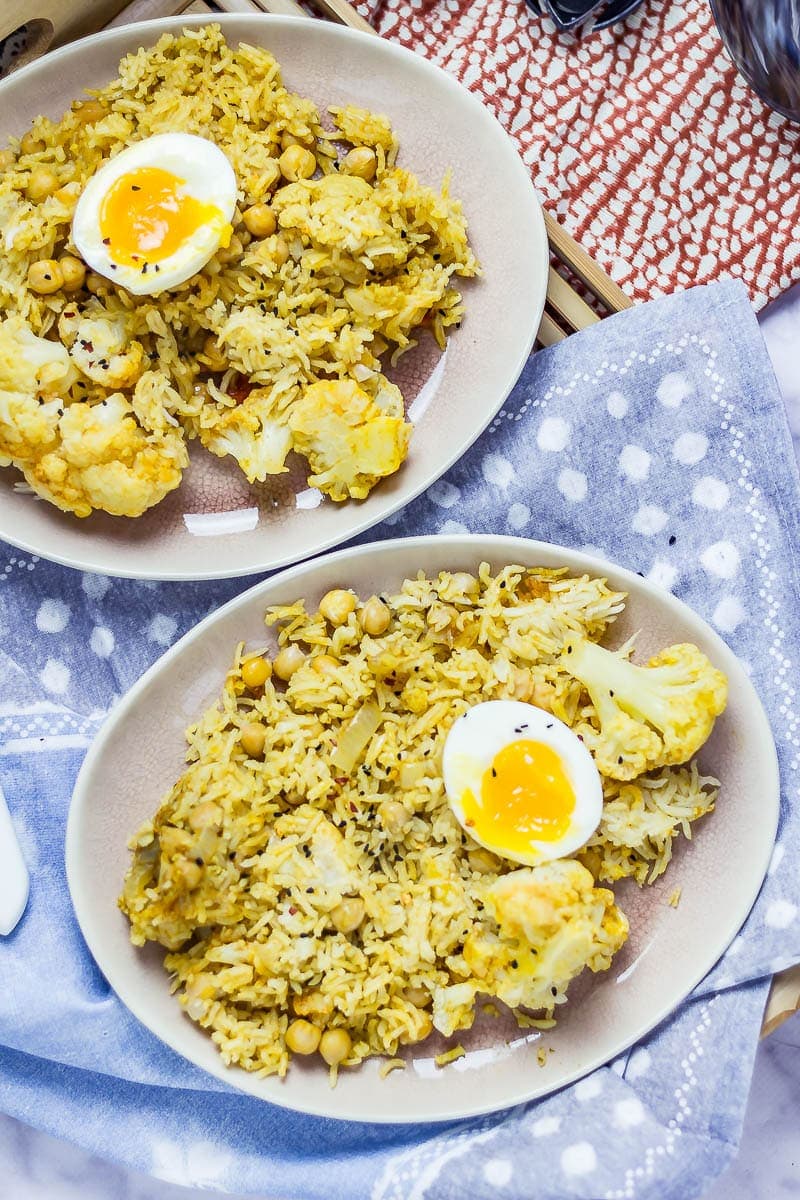 Biryani with Cauliflower & Chickpeas on a wooden tray and blue cloth