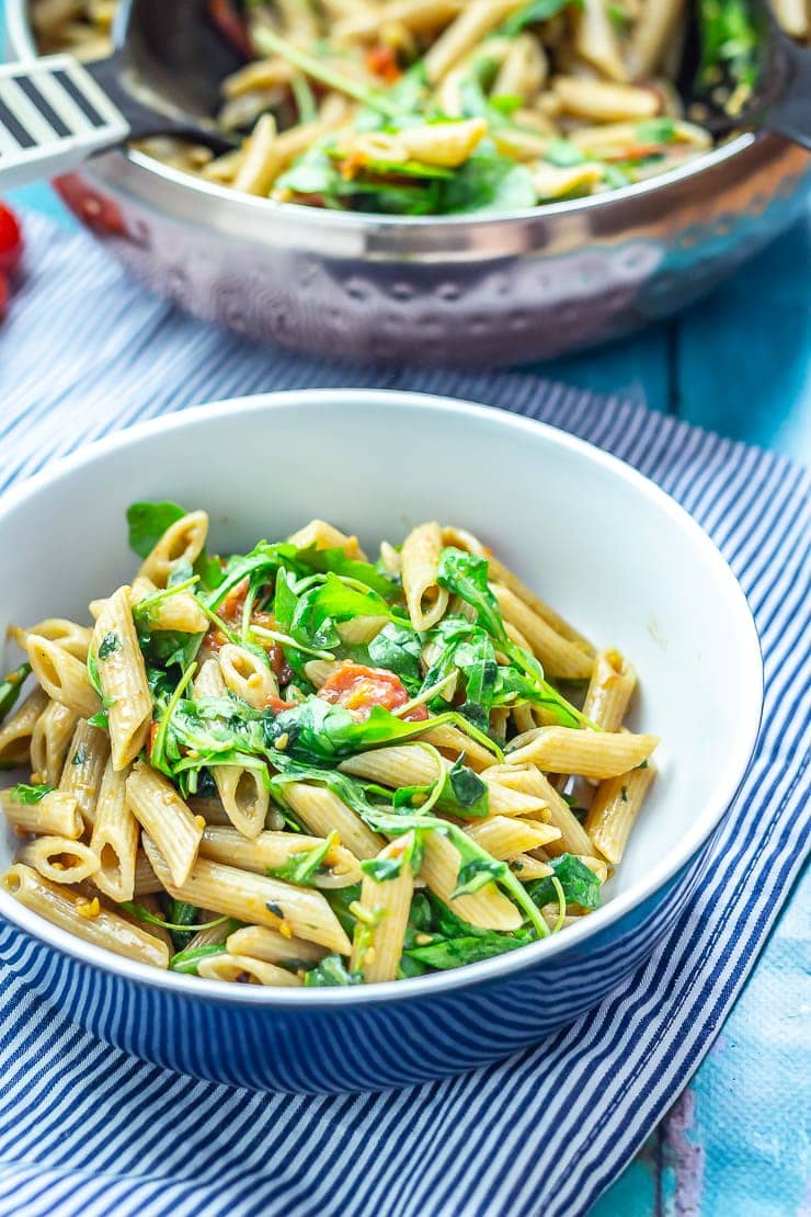 Serving of balsamic pasta salad on a striped cloth 