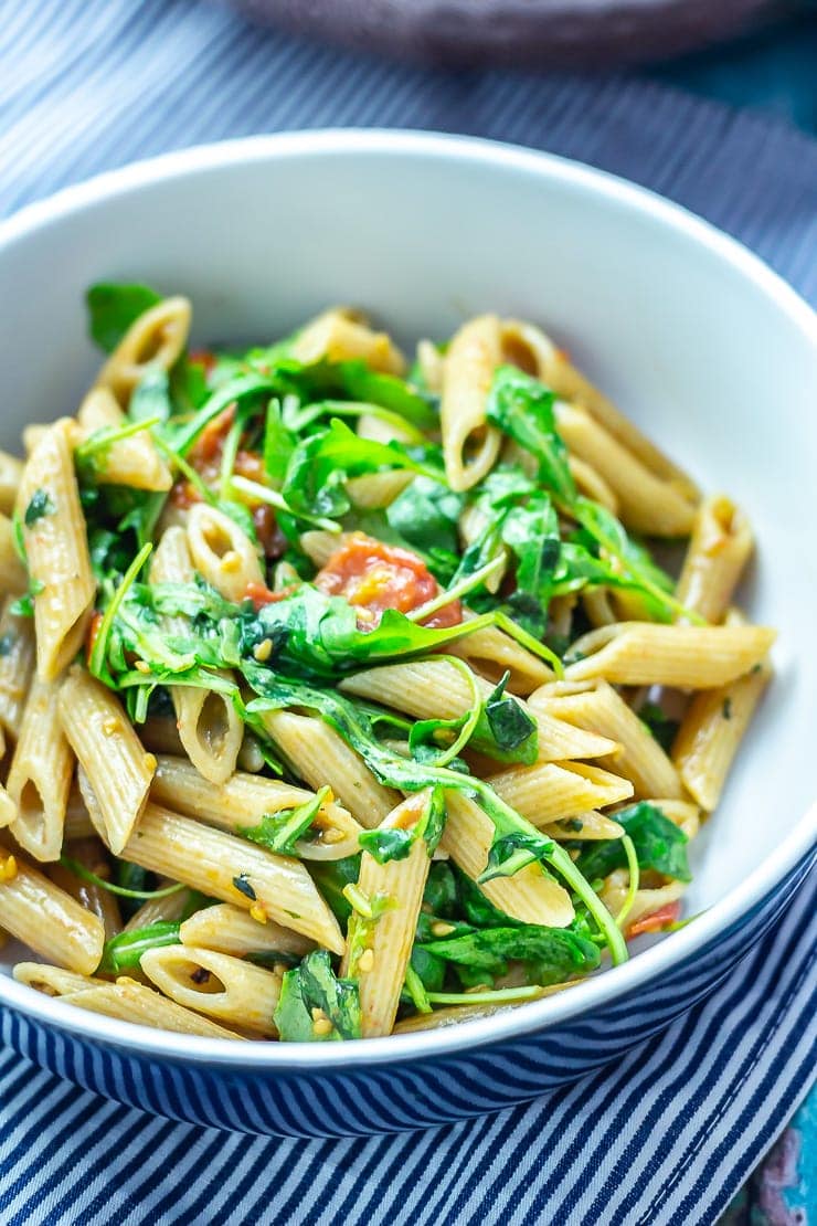 Bowl of pasta salad on a striped cloth