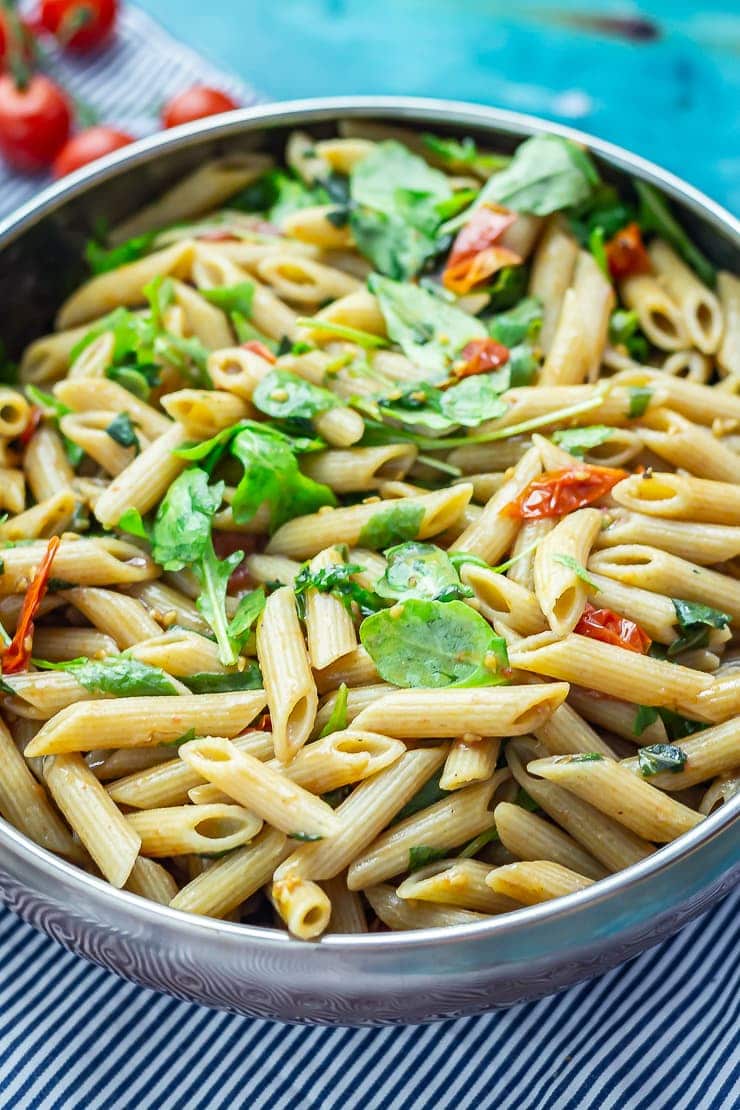 Close up of a big bowl of pasta on a blue background