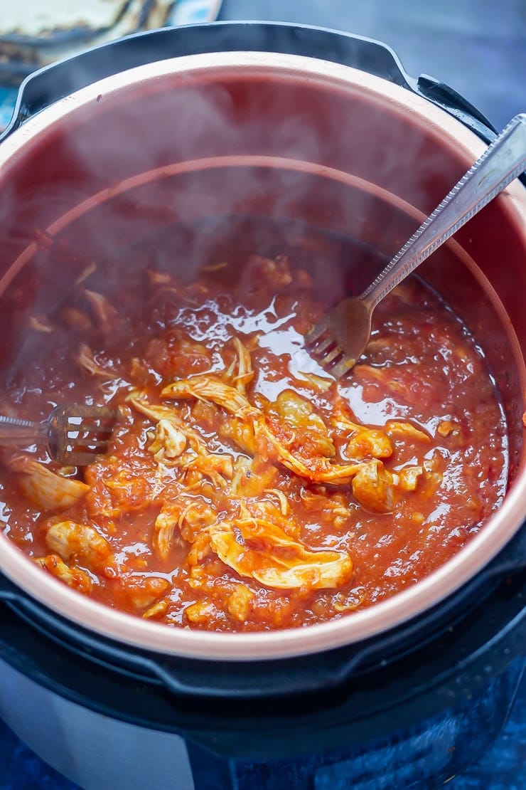 Shredded chipotle chicken taco filling in the pressure cooker